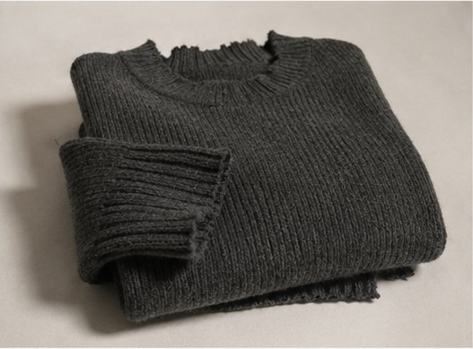 Folded grey wool knit sweater